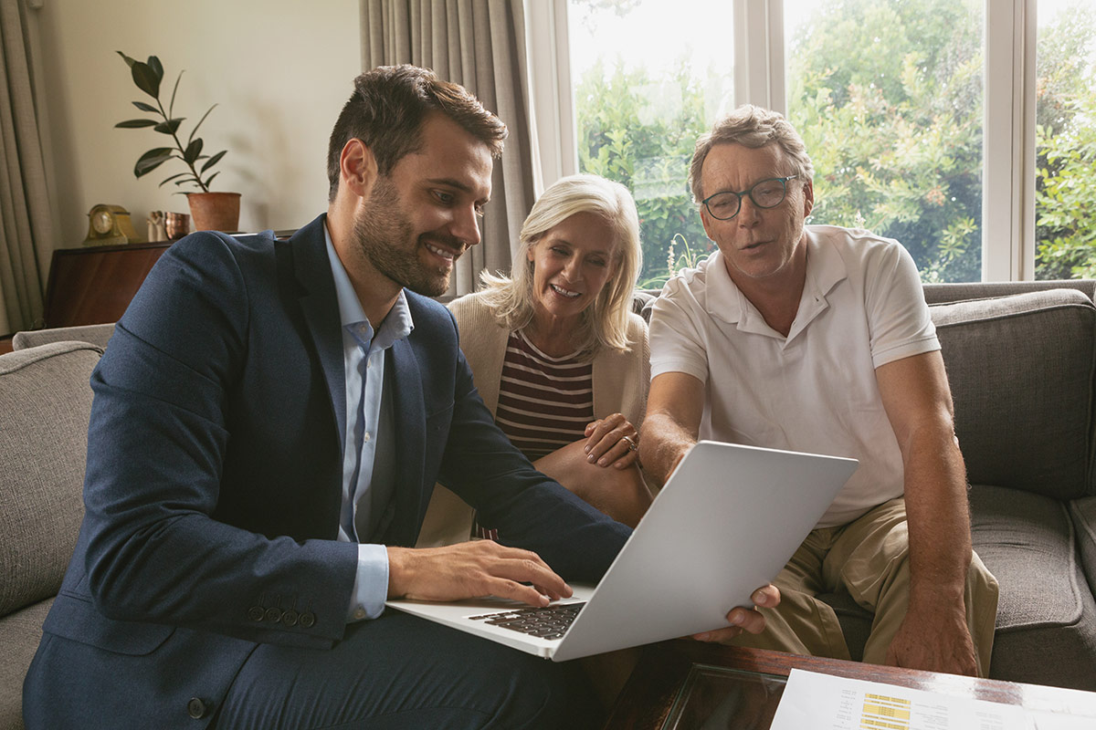 Estate agent with a couple of seniors