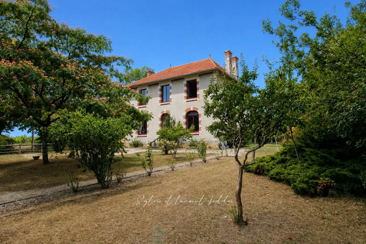 Renovated stone bourgeois house with swimming pool, outbuildings, and over 3.6 hectares of land.